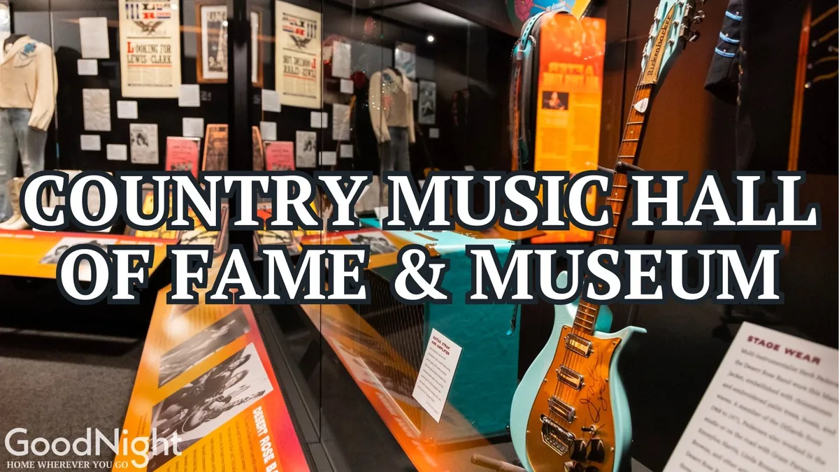 A vibrant display of guitars, original stage wear, and historic posters inside a museum-style exhibition. The scene exudes the energy and inspiration of country music’s evolution, inviting visitors to engage with the memorabilia of music legends.